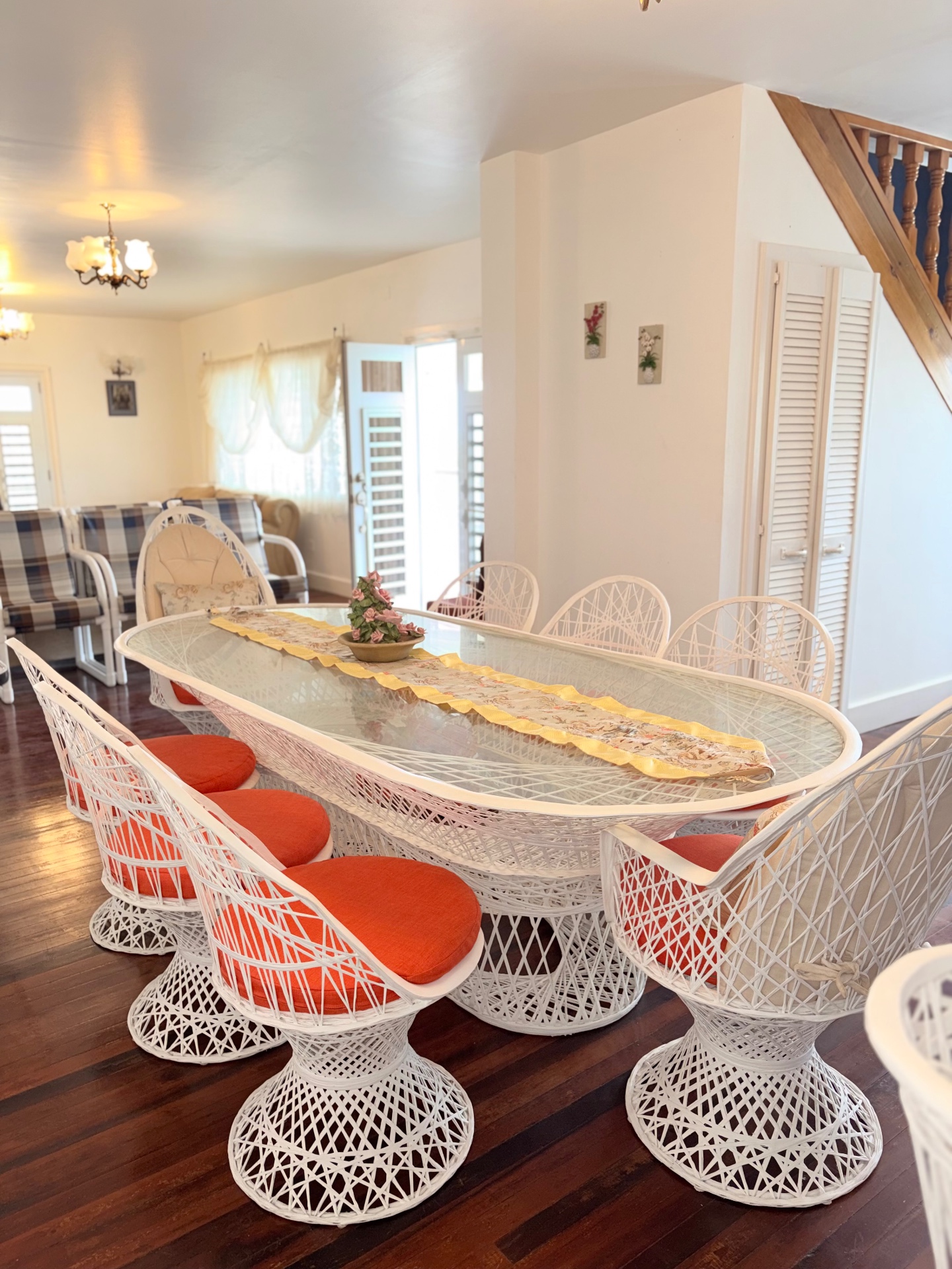 Furnished dining and living area with hardwood floors