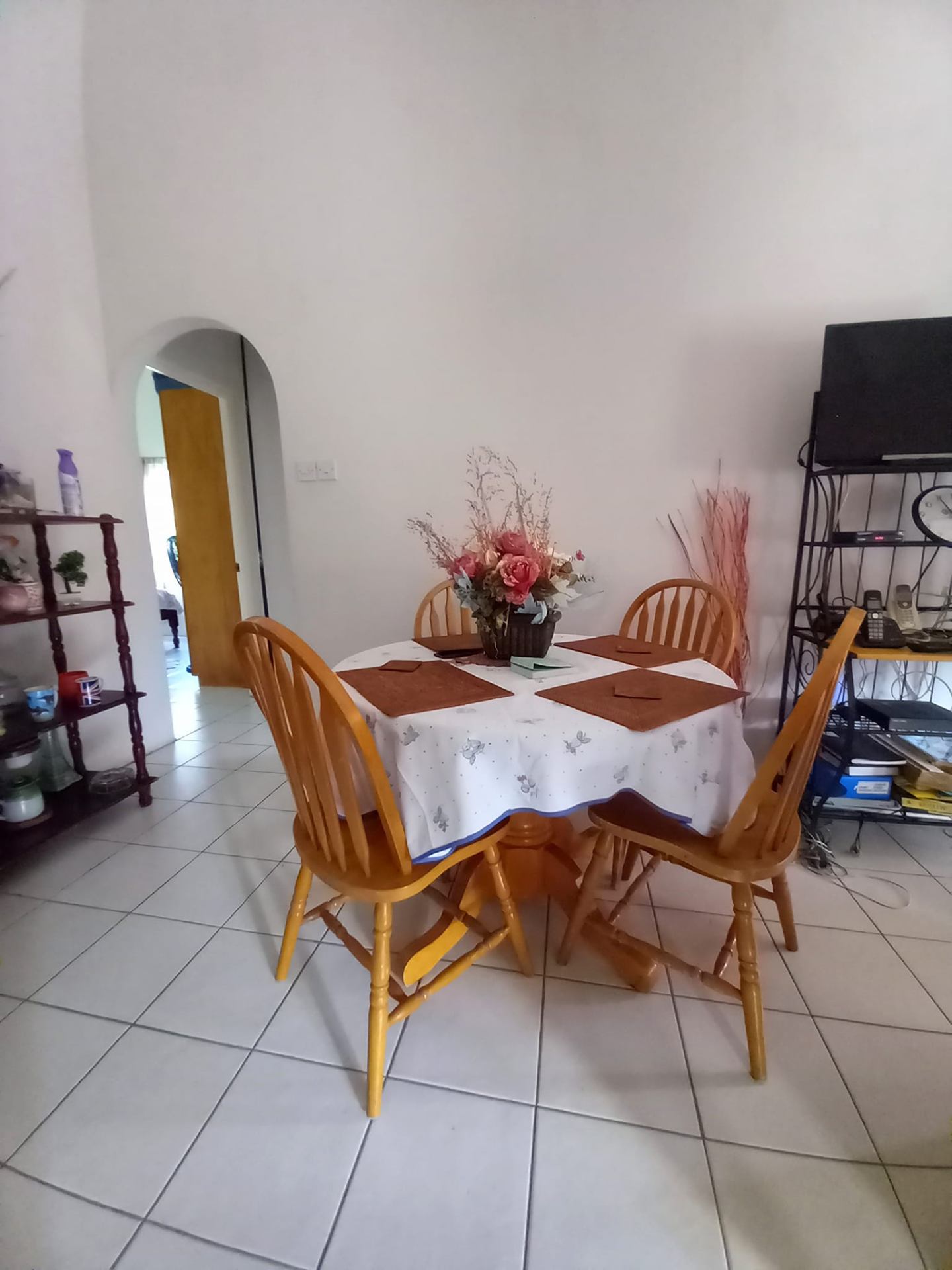 Dining area with archway into hallway