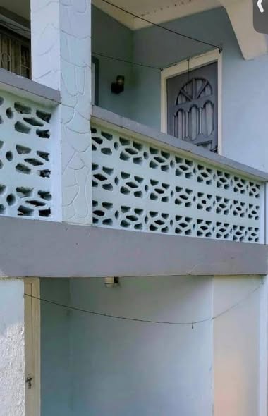 Upper balcony with decorative concrete railing