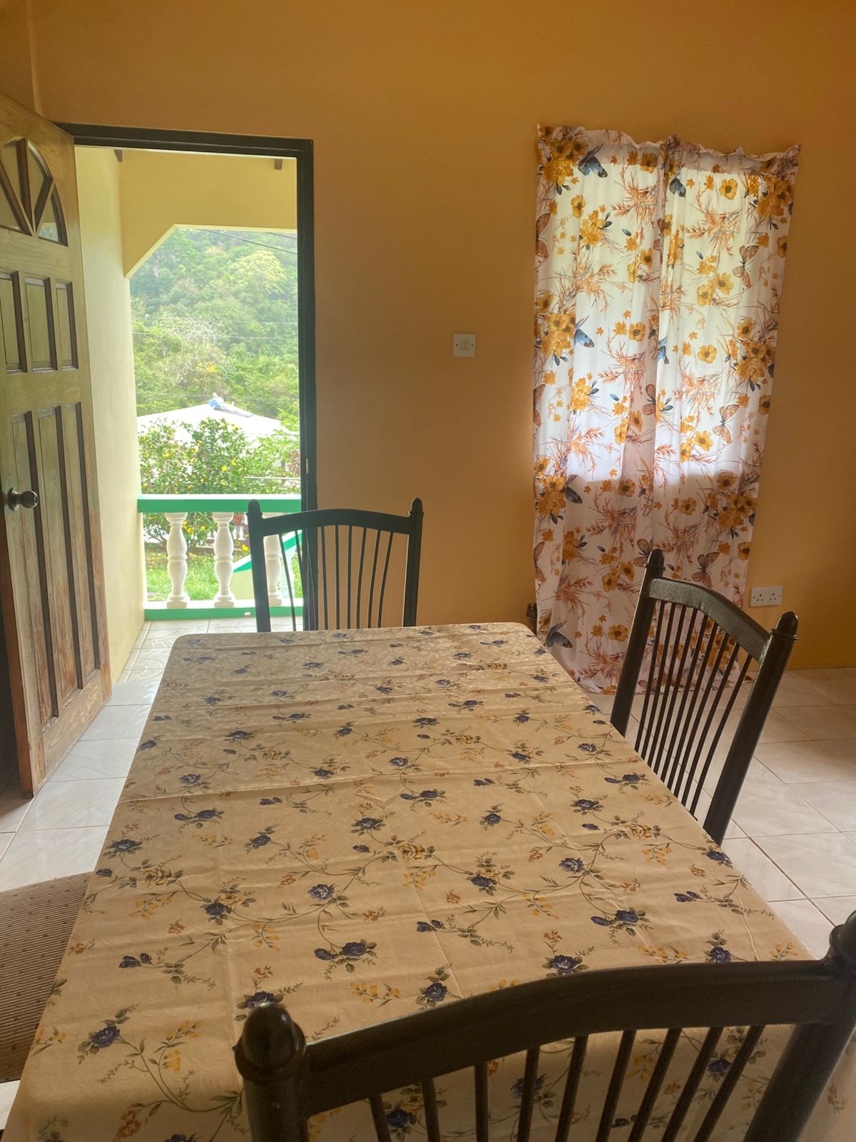 Dining area opening onto a private balcony