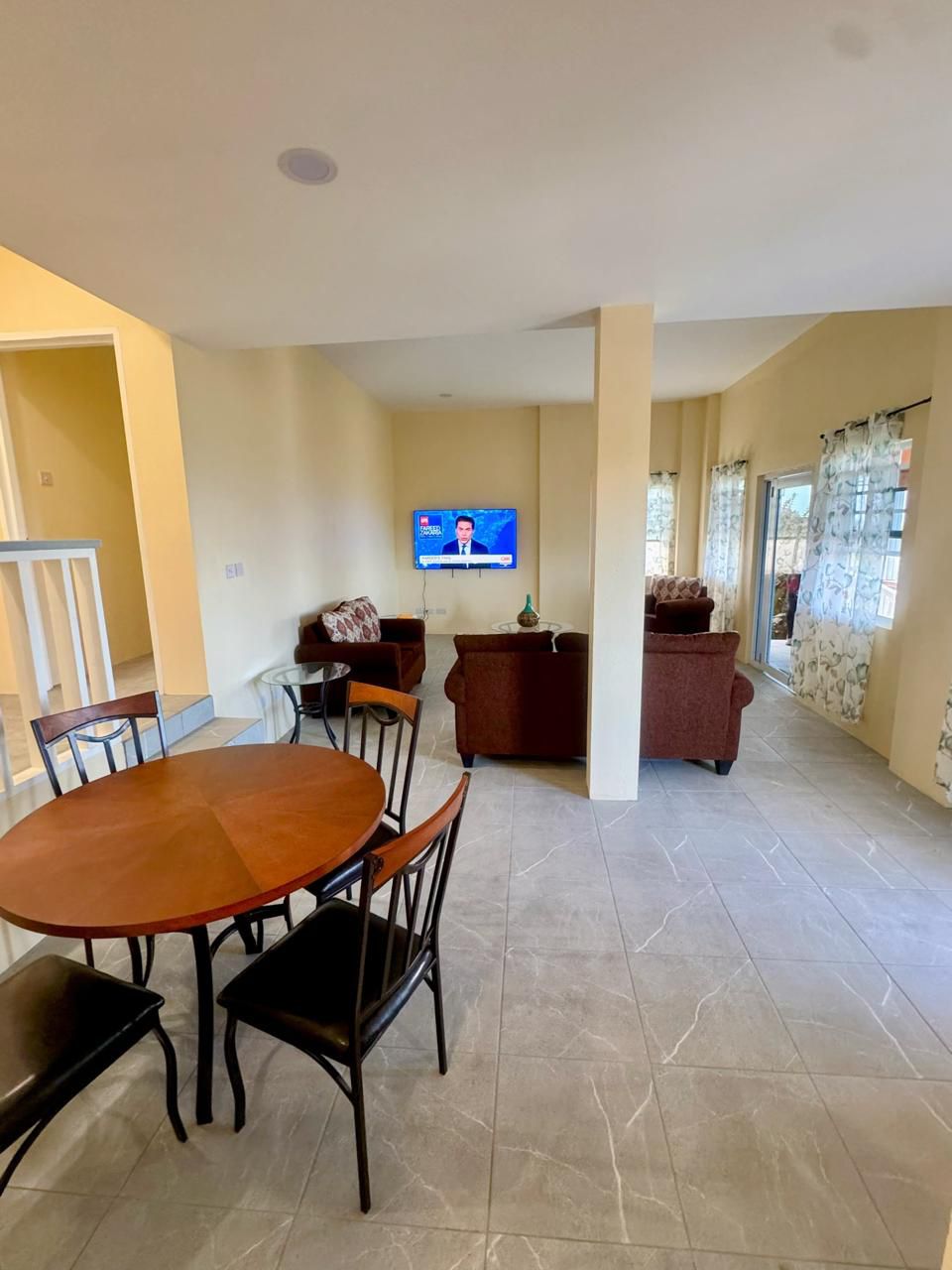 Open-plan living room with seating and dining area
