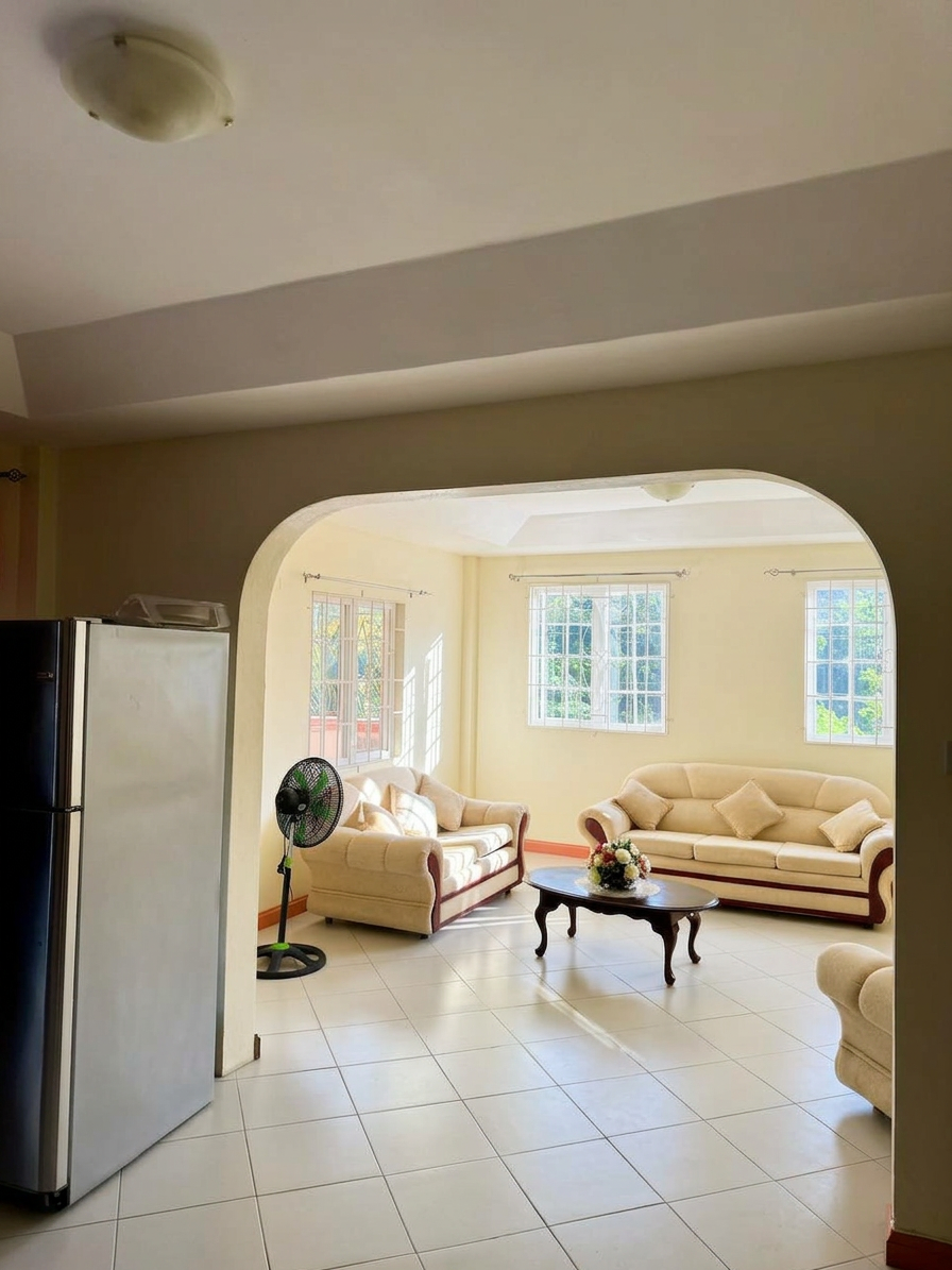 Archway view from kitchen into the spacious living area