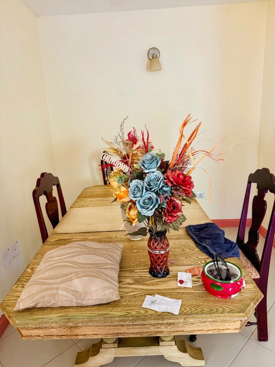 Dining area with wooden table and seating for four