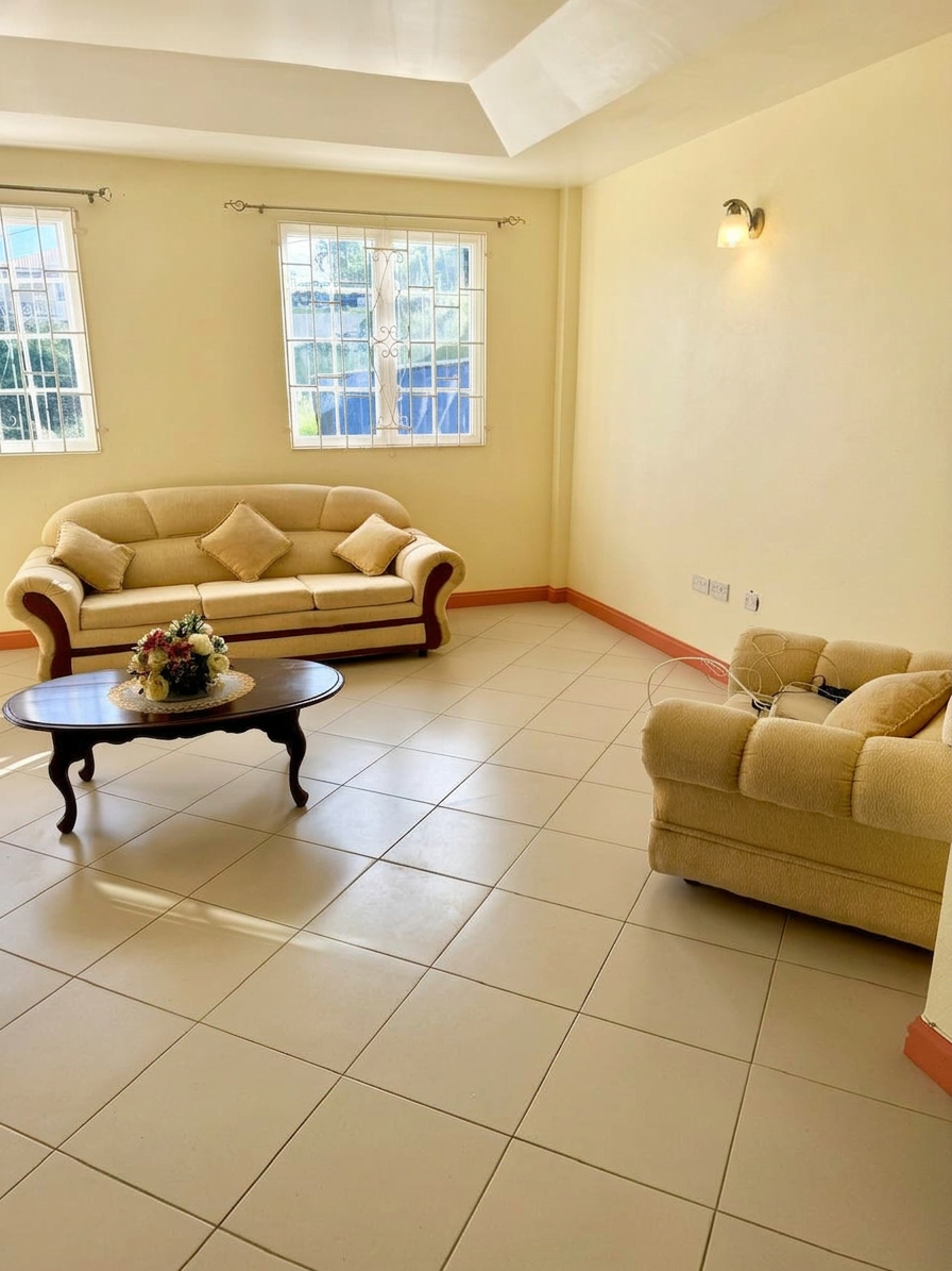 Bright open living room with tiled floors and large windows