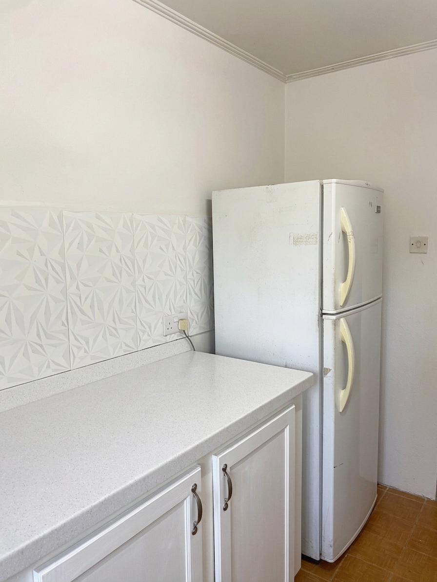 Kitchen corner with refrigerator and additional prep counter space