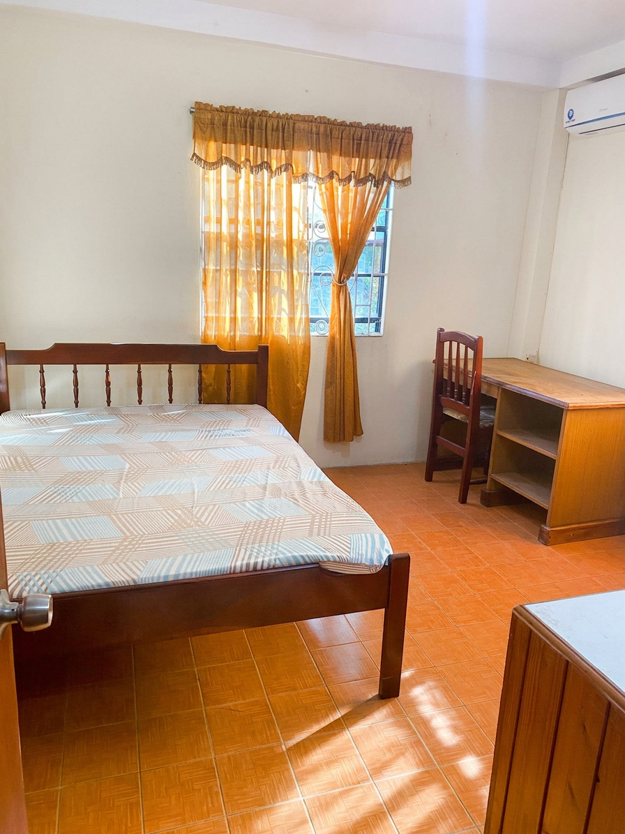 Second bedroom with double bed, desk and air conditioning