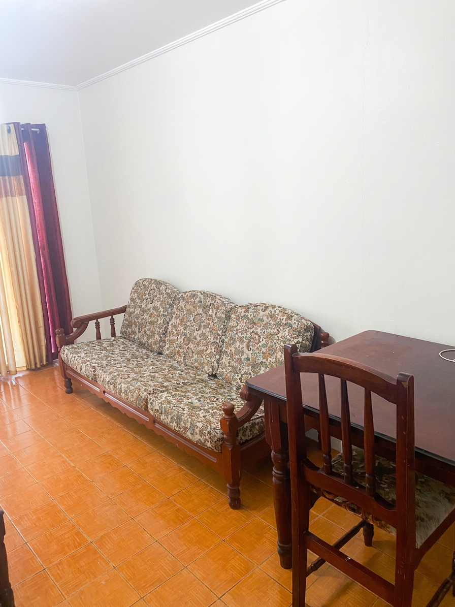 Open living and dining area with sofa and dining table